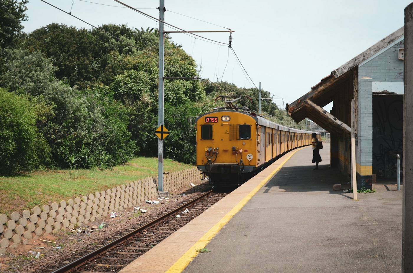 Train arriving at a South African suburban station