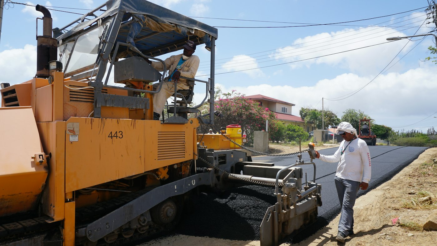 Road crew paving a municipal road